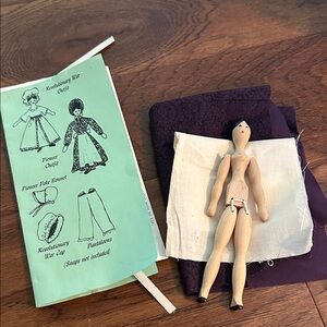 Wooden doll with clothing pattern